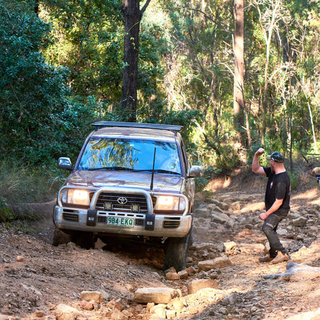 Man fist pumping air after successful 4x4 recovery